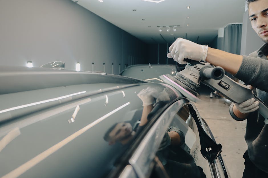 Professional auto detailing team at work